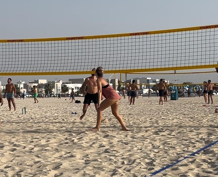 Califit beach volleyball players celebrating together